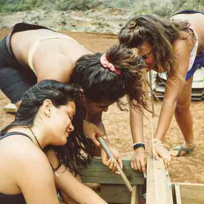 Women constructing a wooden form