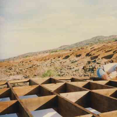 Dan Holmes surveying wooden frame
