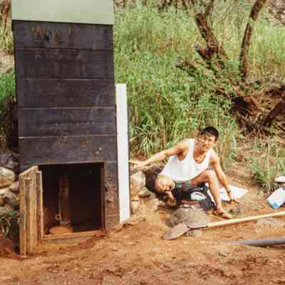 Man pointing to a water gage