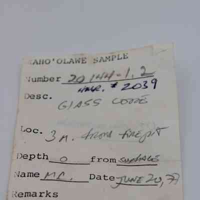 Artifact clip for glass core: The artifact slip displays details including sample number, glass code description, location, depth, and date of collection by M.C. on June 24, 1977.