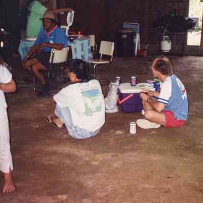 People sitting under shelter