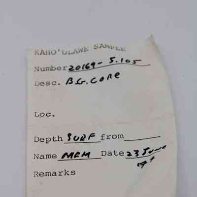 Artifact slip for basaltic glass core: The image shows an artifact slip labeled "Kaho'olawe Sample" with handwritten details about the sample number, description, depth, and date.
