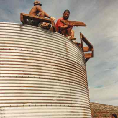 People working on and around water catchment