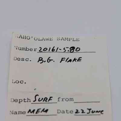 Artifact slip for basaltic glass flake: The image shows an artifact slip labeled as a sample from Kaho'olawe, detailing a flake, collected on June 22.