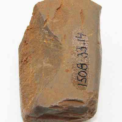 Lengthwise view of adze fragment with alternate id number visible: Origsize: 3.89 cm (l); Origformat: Artifact; Resolution: 200 dpi