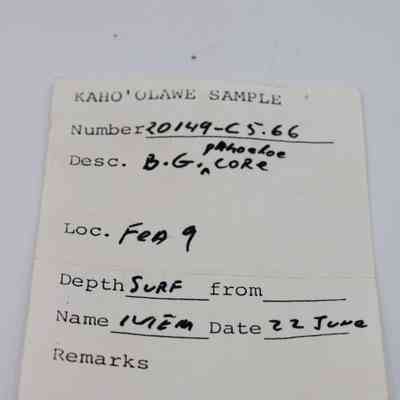 Artifact slip for a basaltic glass pāhoehoe core: The image shows an artifact slip labeled "Kaho'olawe Sample" with handwritten details including number, description, location, and date.