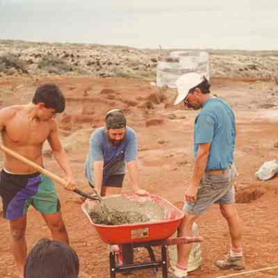 Men mixing concrete