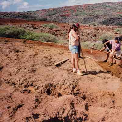 People working above water catchment structure