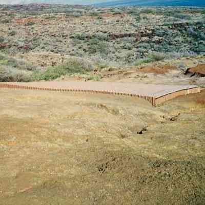 Water catchment structure on hardpan