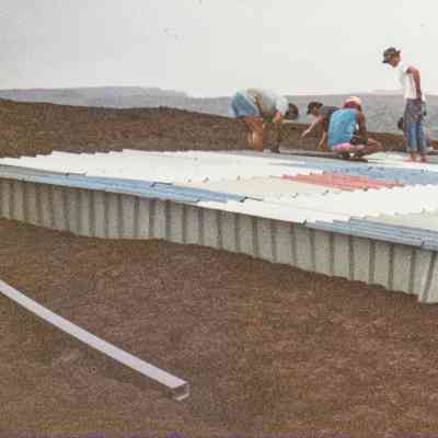 People working on water catchment structure