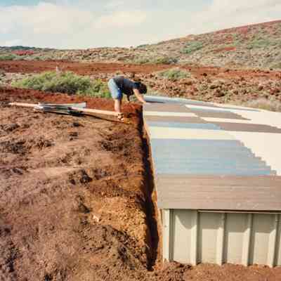 Person working on water catchment structure