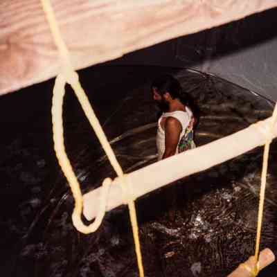Man standing in water in water tank