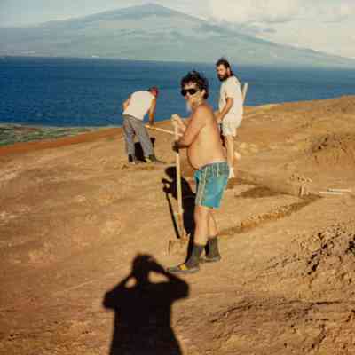 People working on hardpan terrain