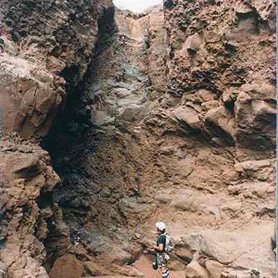 Man looking up at gully: Origsize: 4" x 6"; Origformat: Print-Photographic; Resolution: 200 dpi