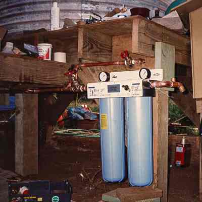Filter or tanks attached to wooden frame