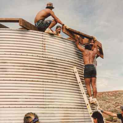 Group of people working on a water catchment structure