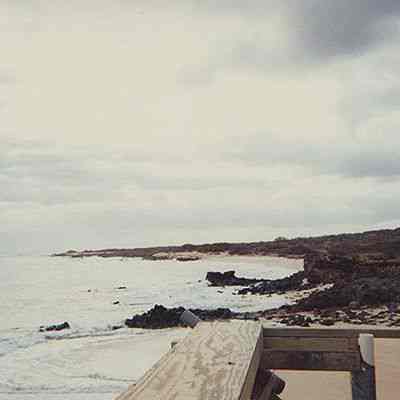 View of white sand beach from observation deck at Base Camp
