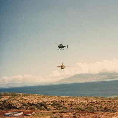 Helicopter transporting construction materials