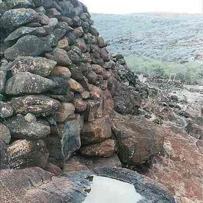 Rock wall with puddle: Origsize: 4" x 6"; Origformat: Print-Photographic; Resolution: 200 dpi