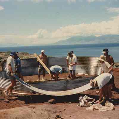 Several people at water catchment site