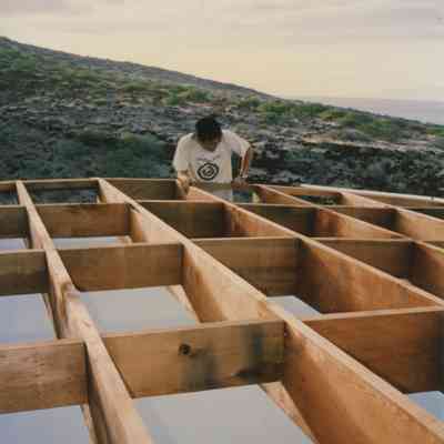 Man working on wooden frame