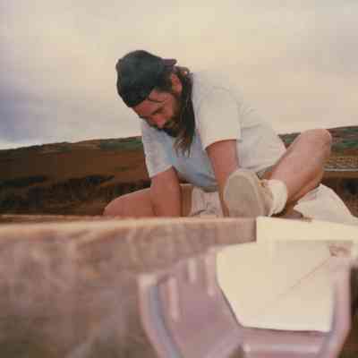 Dan Holmes working on a wooden frame