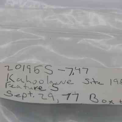 Artifact bag label: The image shows a labeled plastic bag for artifacts, marked with "Kahoolawe Site 195, Feature S, Sept. 29, '77