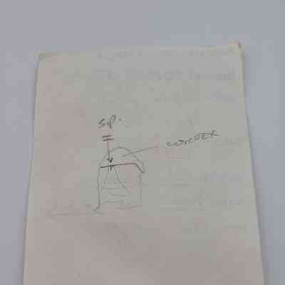 Back of artifact slip for a basaltic glass flake: The image shows an artifact slip with a hand-drawn diagram, notes, and faded text, related to an archaeological sample.