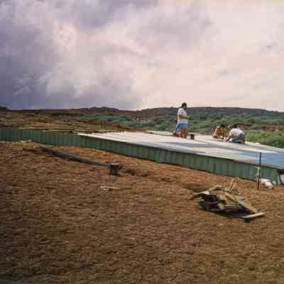 People working on top of water catchment