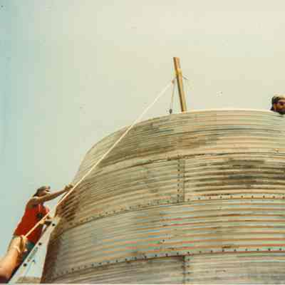 Two men working on water catchment