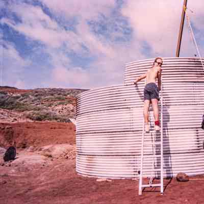 Men working on metal water catchment