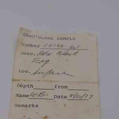 Artifact slip for adze blank fragment: The image shows an aged Kaho'olawe artifact slip with handwritten details including a sample number, description, location, and date.