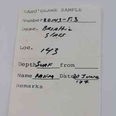 Artifact slip for basaltic glass piece: The image shows a sample label from Kaho'olawe with details including number, description as basaltic glass, location, surface depth, name and date.