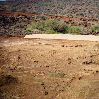 Hardpan terrain with material covering