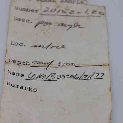 Artifact slip for a possible auger: The image shows an aged artifact slip labeled "KAHO'OLAWE SAMPLE," listing number 20152-1.20, with details.