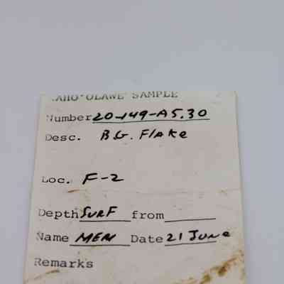 Artifact slip for basaltic glass flake: The artifact slip is a labeled form with handwritten notes detailing the sample number, description, location, and collection date.