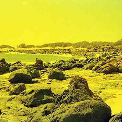 Rocky coastline and white sand beach