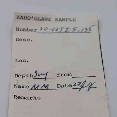 Artifact slip of basaltic glass flake: The image shows an artifact slip labeled "Kaho'olawe Sample" with fields like number, description, location, depth, name, and date.