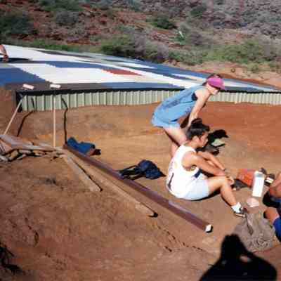 People sitting on hardpan terrain