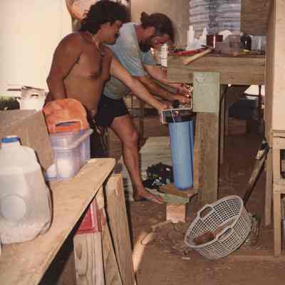 Men working on filter system