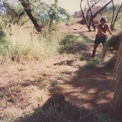 Man clearing weeds
