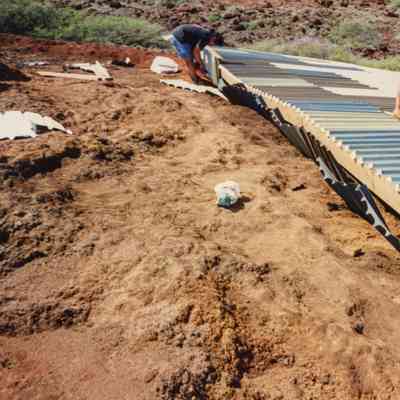 People working on water catchment structure