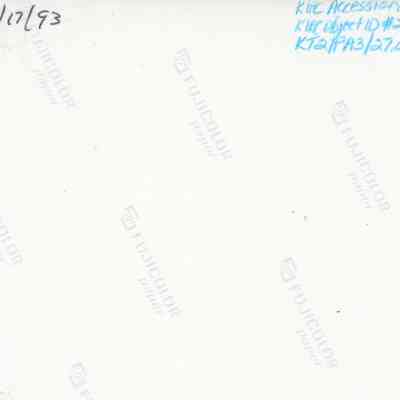 Back of photograph (KIRC Object ID #2013.019.526(: The image displays the back of a photograph with handwritten notes, including a date, accessional numbers, and the FUJICOLOR paper watermark.