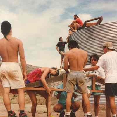People assembling a wooden frame