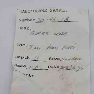Artifact slip for glass core: The image shows an artifact slip with handwritten details about a sample from Kahoʻolawe, including number, description, location, depth, and name.