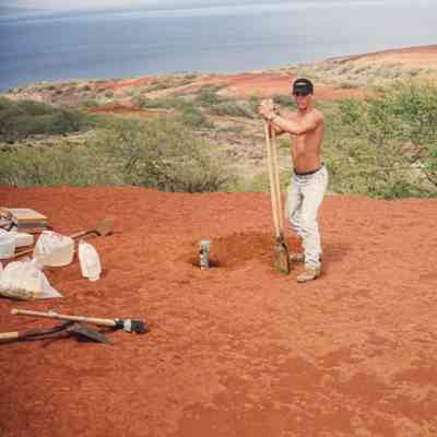 A person watching a man on hardpan terrain