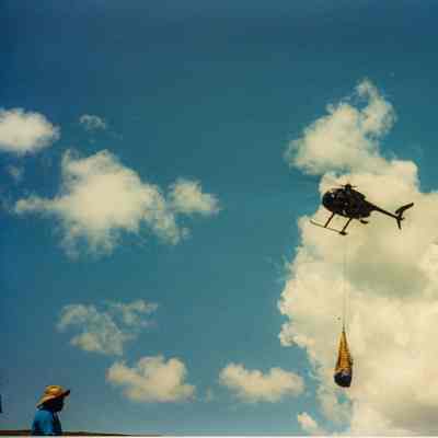 Helicopter in air with cargo net
