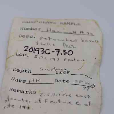 Artifact slip for basalt awl (kui houhou): The image shows an artifact slip detailing a retouched basalt flake/awl, with specific site, date, and location information handwritten.