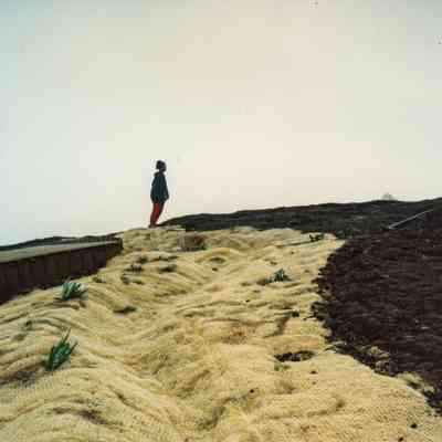 Woman standing on fabric matting