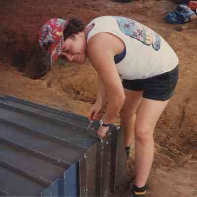 Person working on water catchment structure